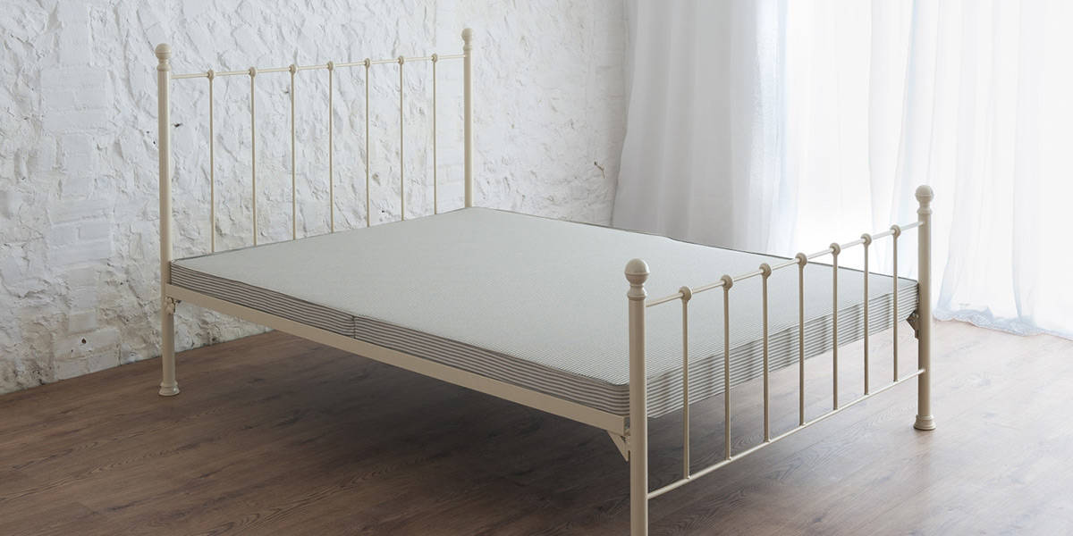 4-inch unsprung bed base with traditional butcher's stripe ticking
