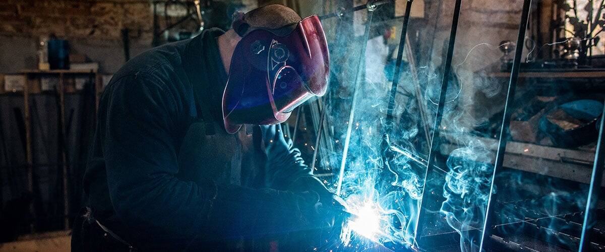 Iron fabrication workshop with bed components in process