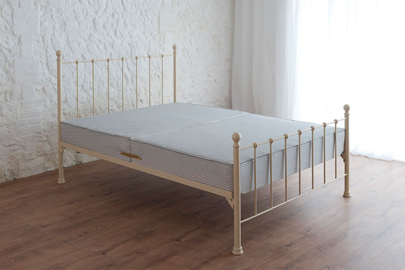sprung bed base on a metal iron bedframe