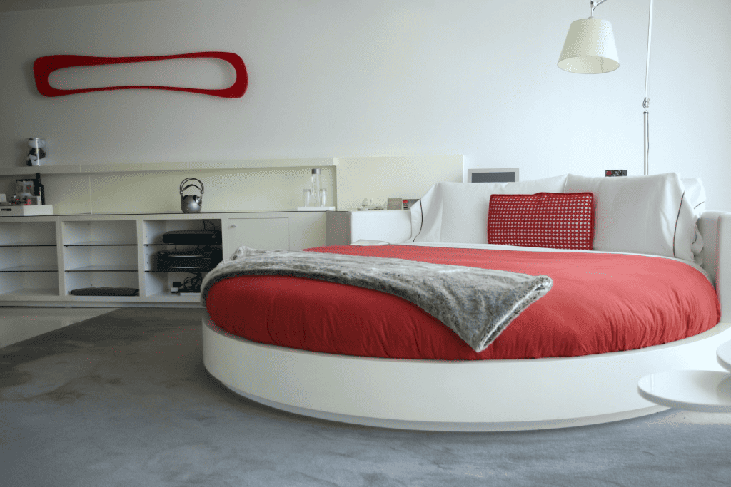 Retro round bed with red bedding