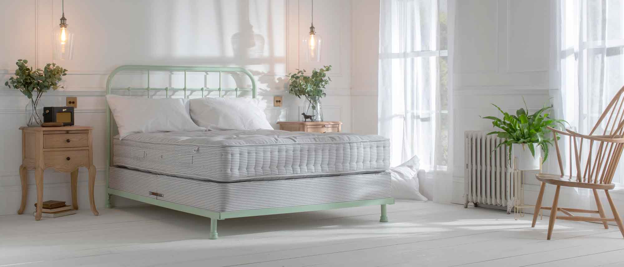pocket sprung mattress on mint green iron bed frame 