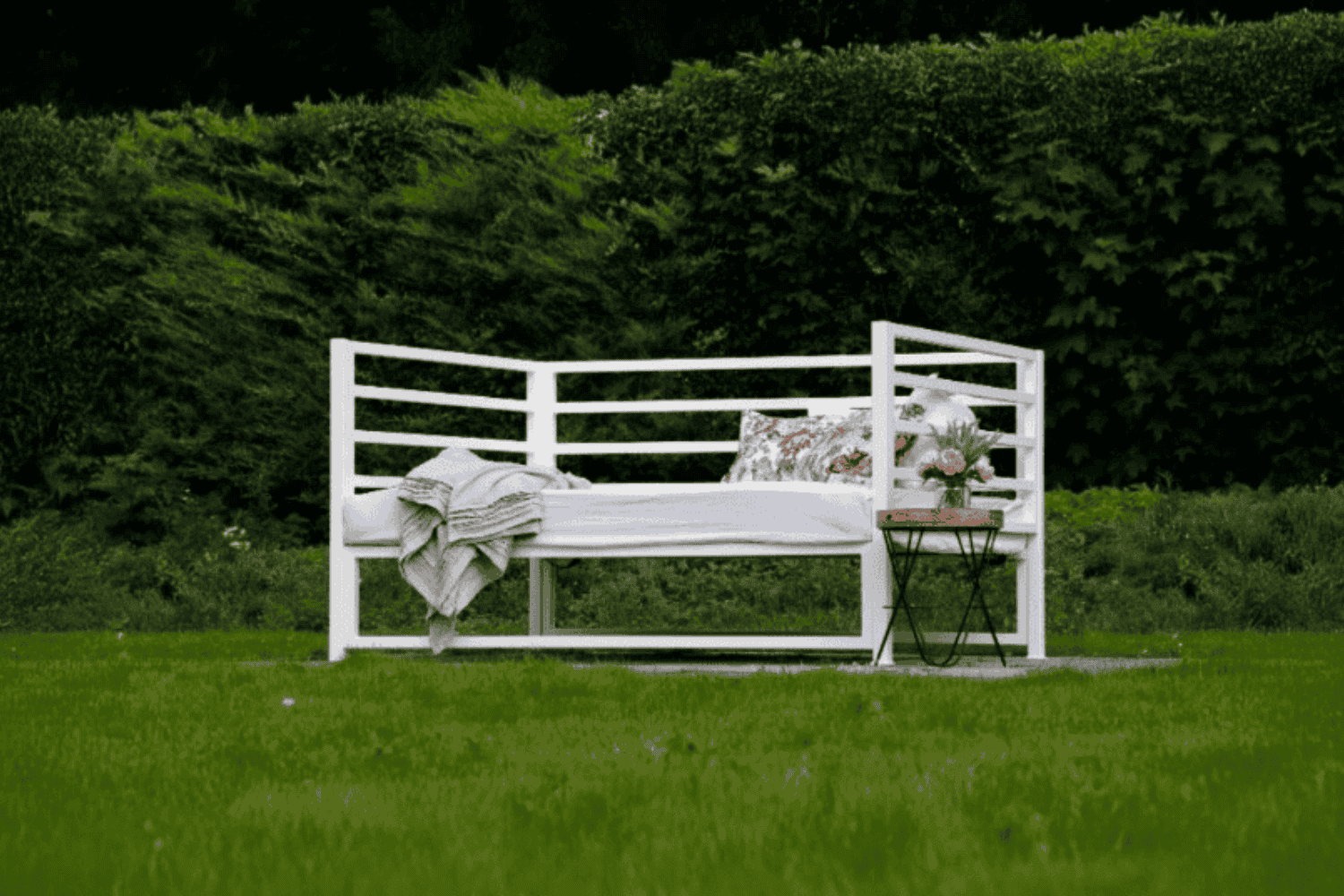 Sunna outdoor bed frame in garden – front view